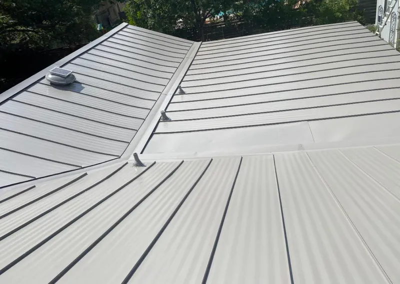 Solar attic fan installed on a metal roof for Roof Ventilation in Redwood City